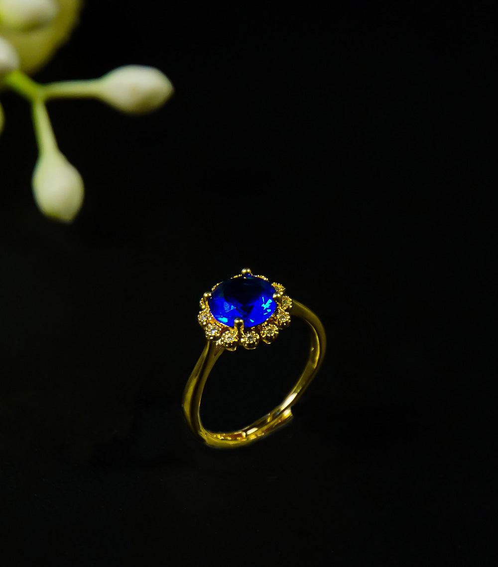 Golden rings with blue stone