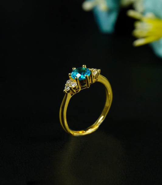 Golden Ring with sky blue stone