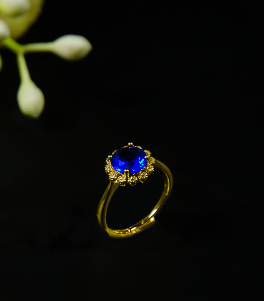 Golden rings with  blue stone